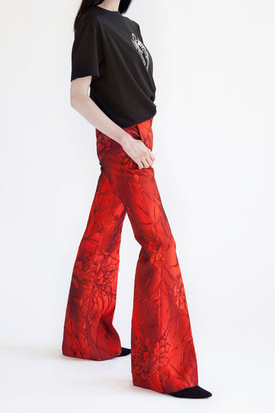 flared pants in  lava red flower jacquard