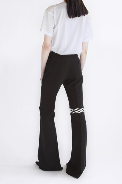 classic flared pants with printed knee detail