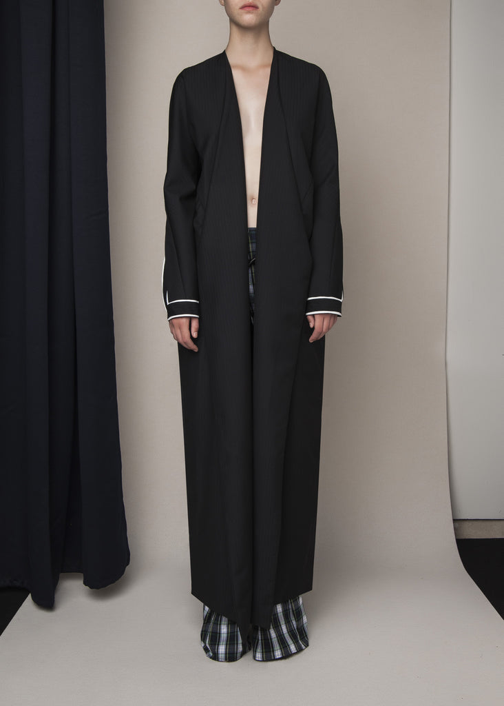 long pinstripe coat in black wool with designed sleeves