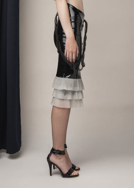 pencil skirt in black vinyl with plisse hem